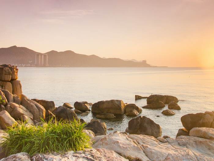 Golden sunset over rocks and sea on the central coast